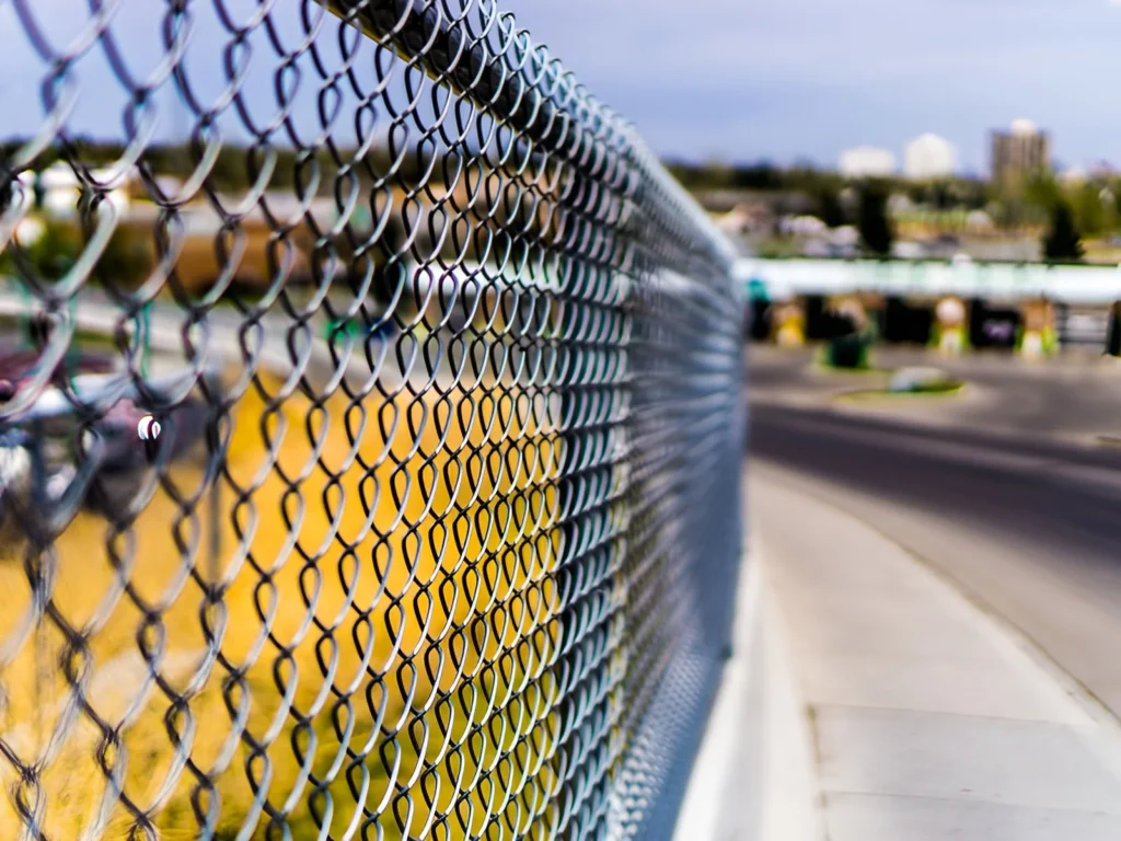 An image showing various types of chain link fences for security and boundary definition.