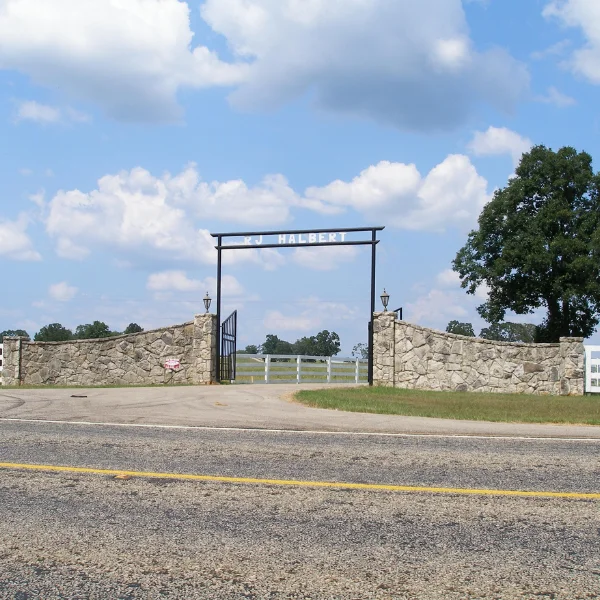 An image showing a modern ranch gate with advanced access control features.