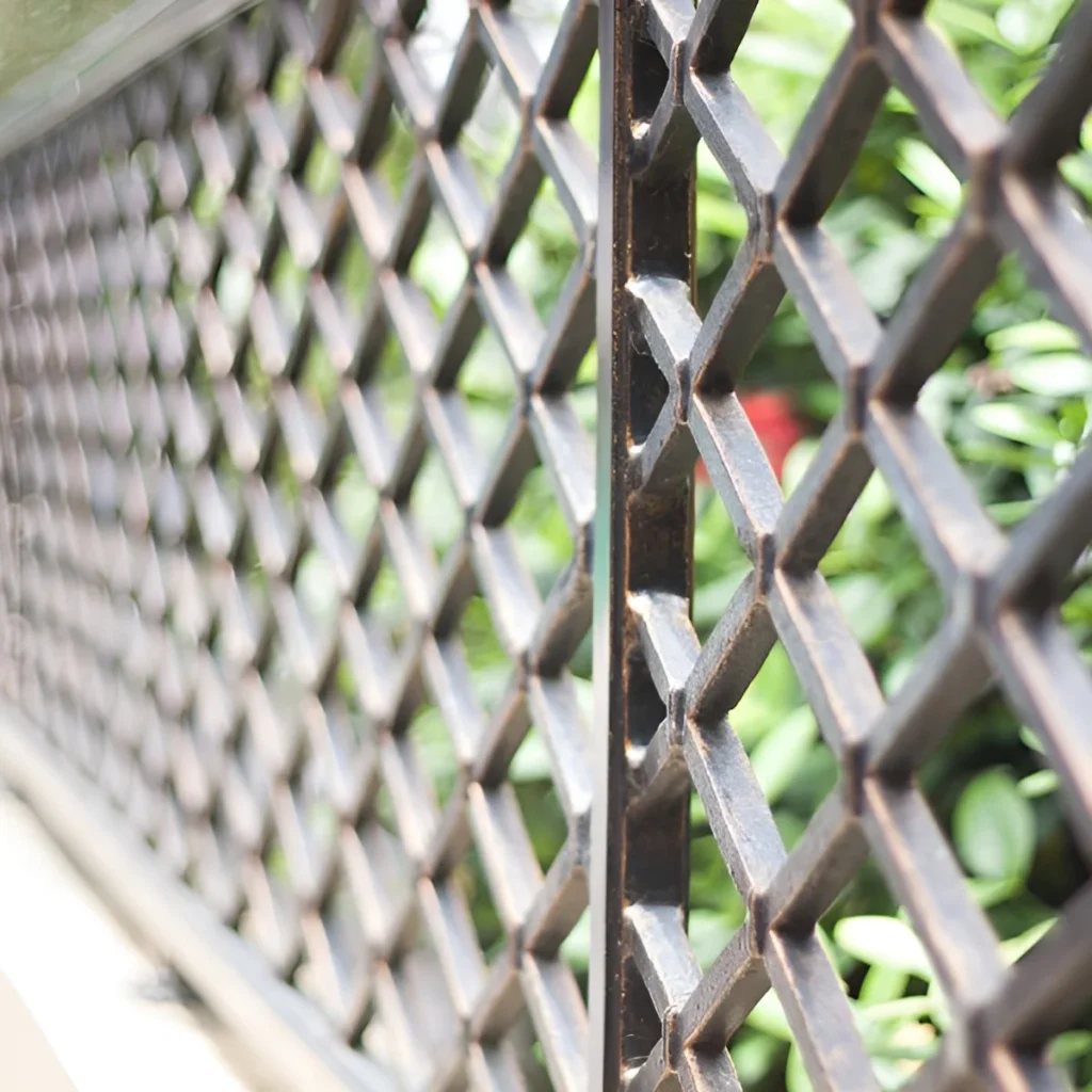 An image showing elegant aluminum fencing in a residential yard.