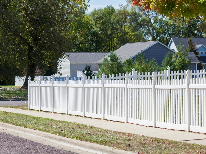 A Phoenix fence contractor installing custom vinyl fencing.