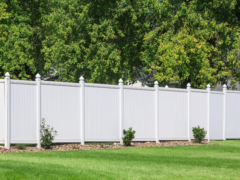A clean low maintenance vinyl fence.