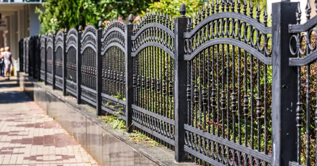 Aluminum and wrought iron fence comparison at a Phoenix, Arizona property,