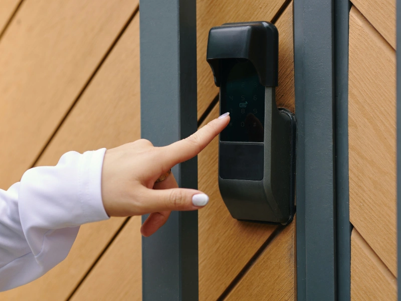 An automatic commercial security gate with keypad access.