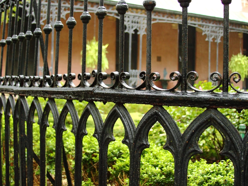 Secure aluminum and wrought iron fencing protecting a Phoenix property.